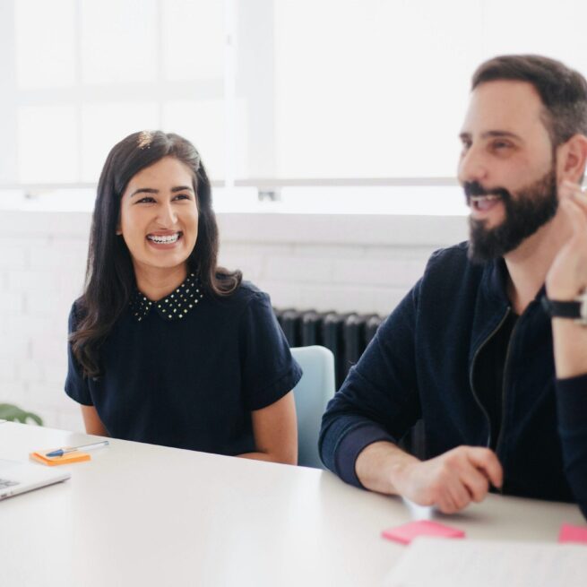 Recruitment solutions Woman and man smiling at work
