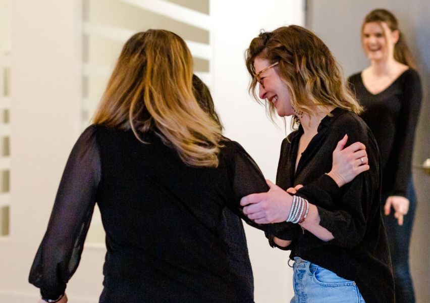 Tandem Innovation Group’s Relationship Manager, Angela Wong-Moon, Supporting Brand & Engagement Manager, Hilary Henegar, in a Team-Building Exercise for a Healthy Workplace Culture in Vancouver, BC. Fractional HR consulting services for businesses