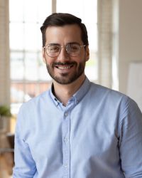 Portrait,Of,Smiling,Young,30s,Handsome,Bearded,Businessman,In,Eyeglasses